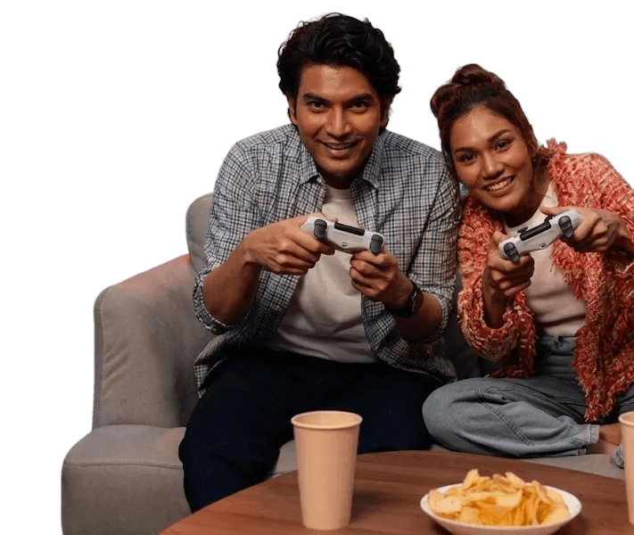 Couple gaming late at night on couch